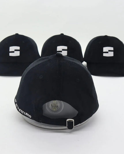 black “splattlestudio” dad hat